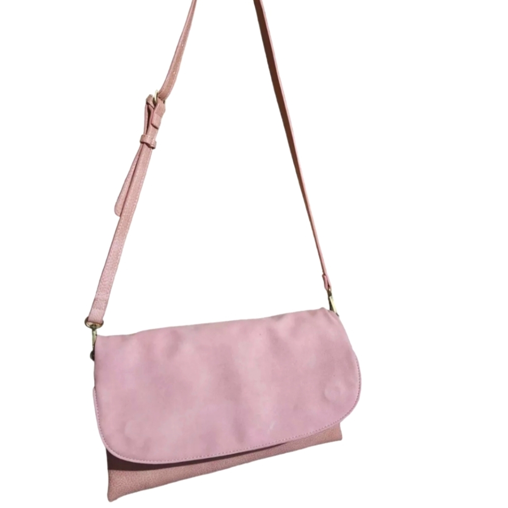 Anthropologie pink fold over adjustable strap crossbody purse. Gently used.